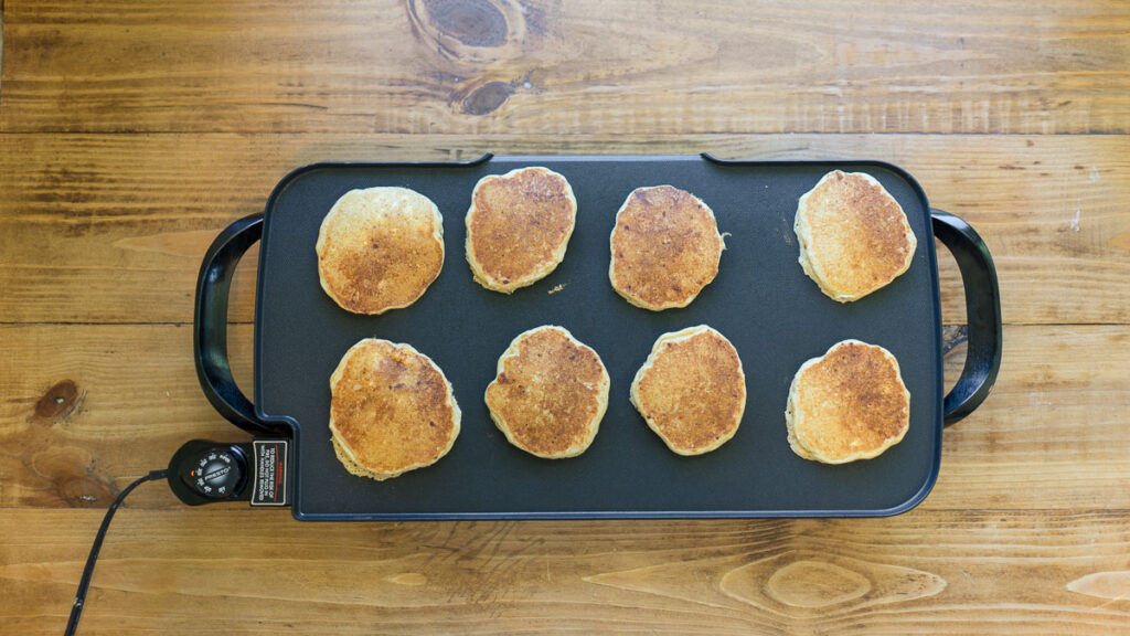 fresh-milled sourdough protein pancakes cooking on griddle